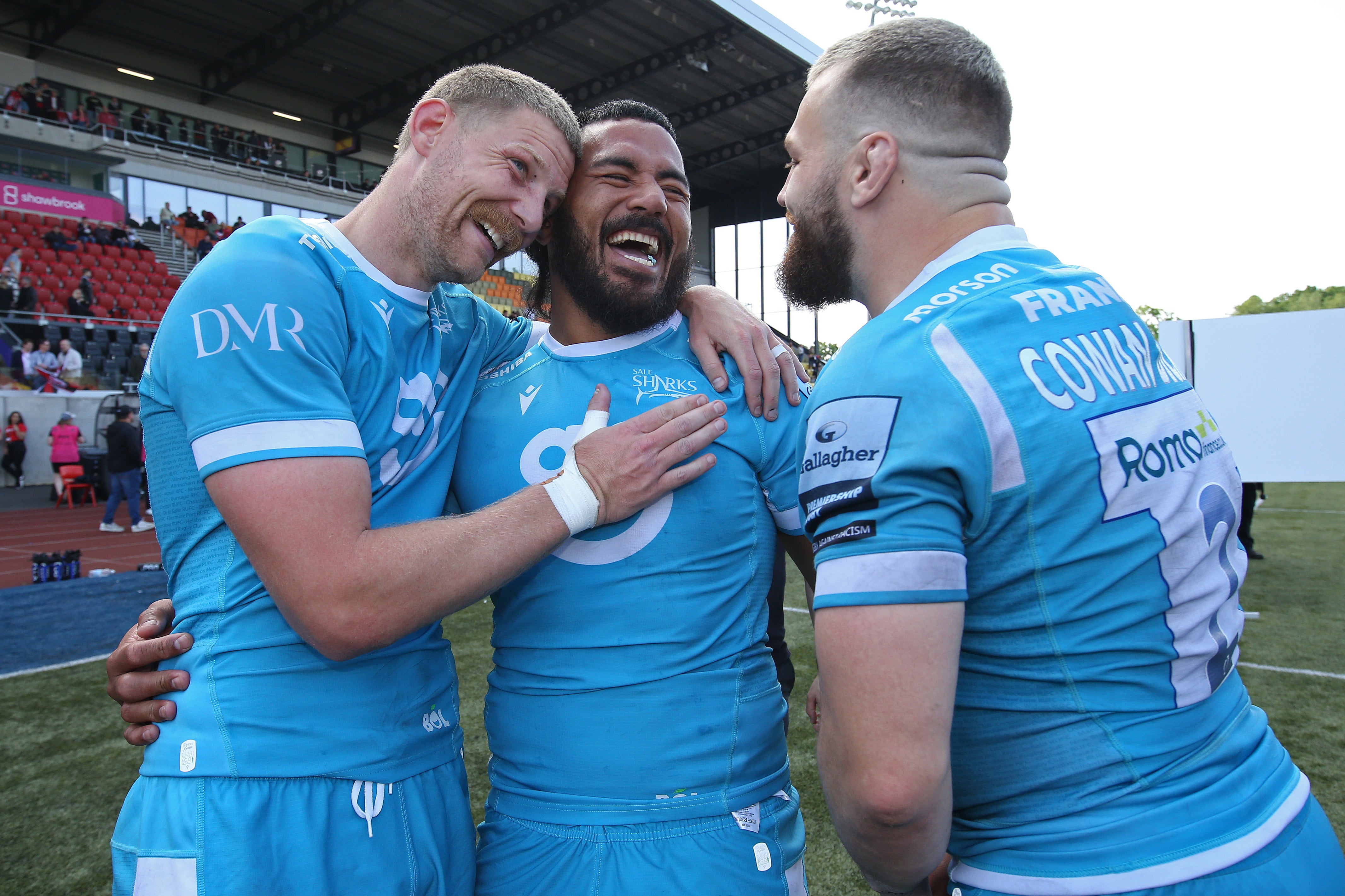 Rob du Preez, Manu Tuilagi and Luke Cowan-Dickie of Sale Sharks celebrate after the Gallagher Premiership Rugby match with Saracens
