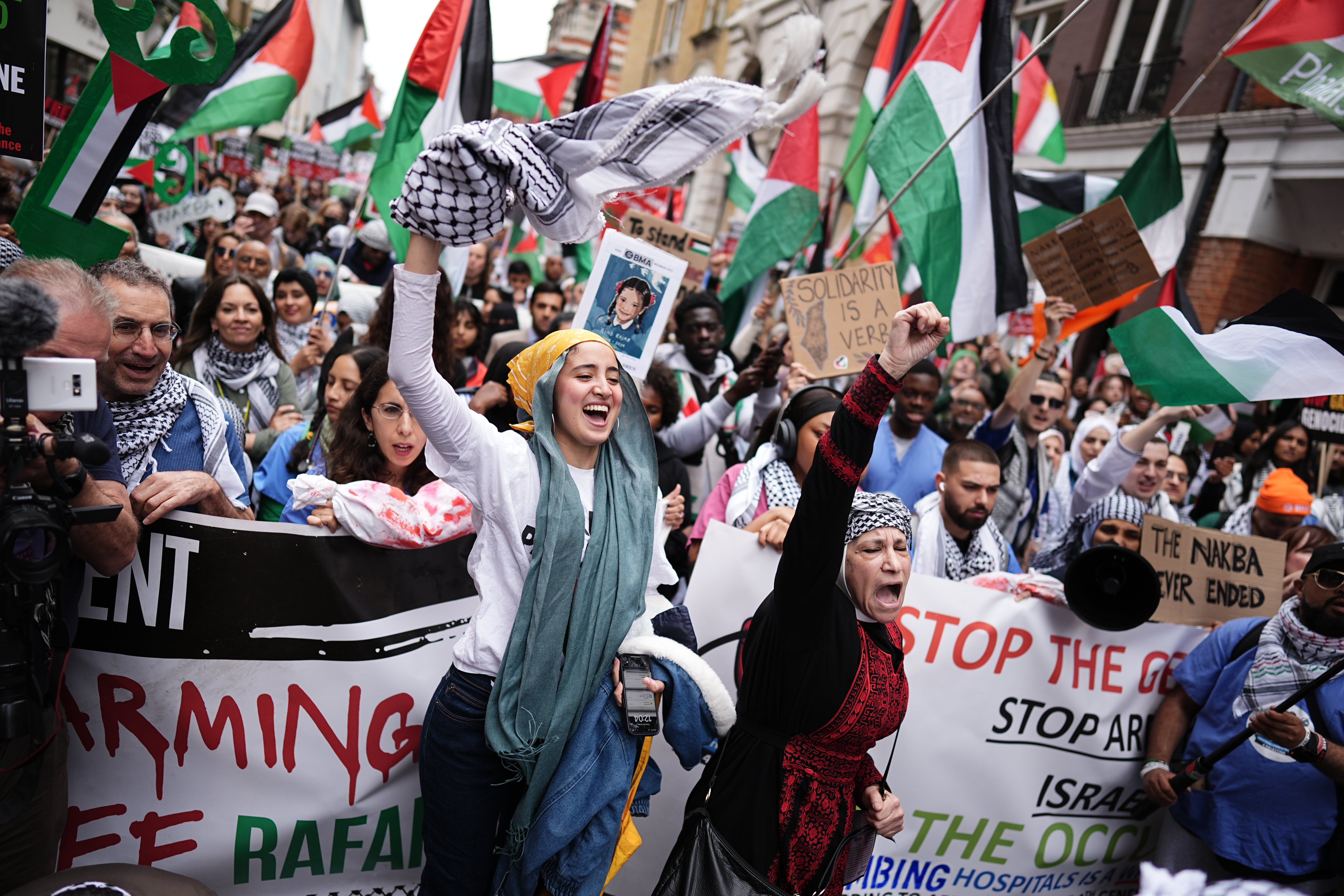 People take part in a Nakba 76 pro-Palestine demonstration in London to mark the mass displacement of Palestinians in 1948