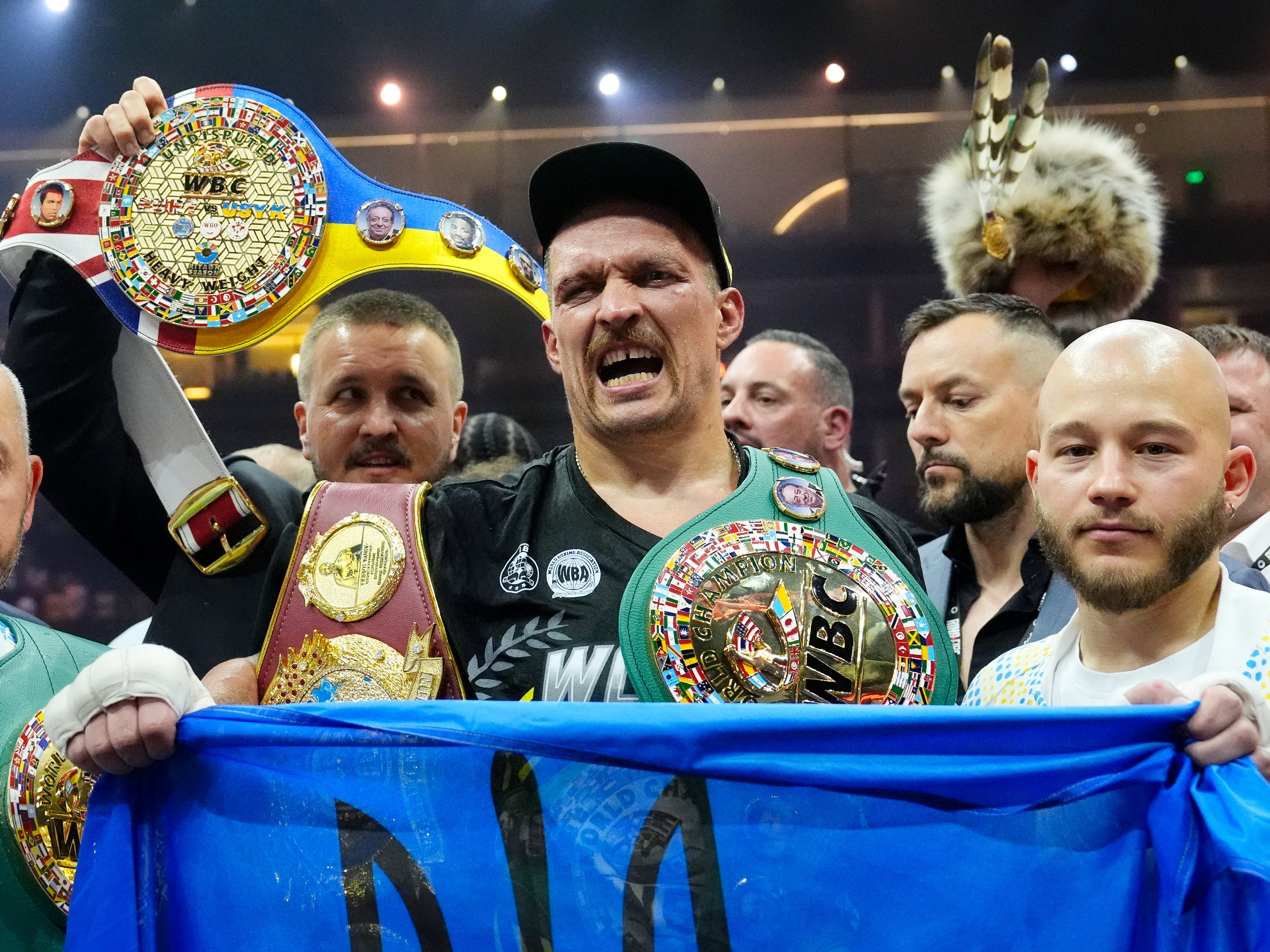 Oleksandr Usyk celebrates with the Undisputed Heavyweight title belt