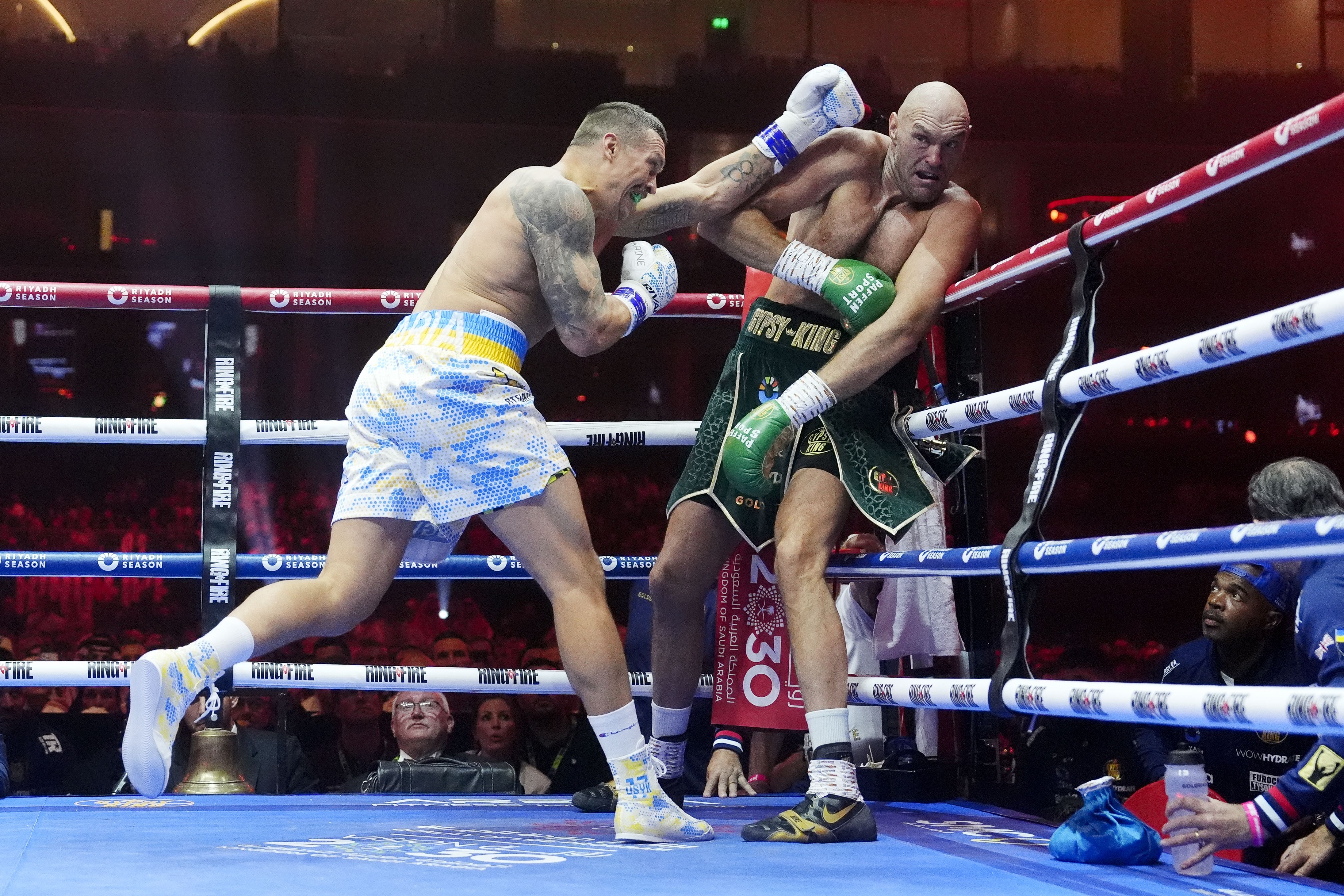 Oleksandr Usyk lands a punch on Tyson Fury during the heavyweight championship fight at Kingdom Arena, Riyadh