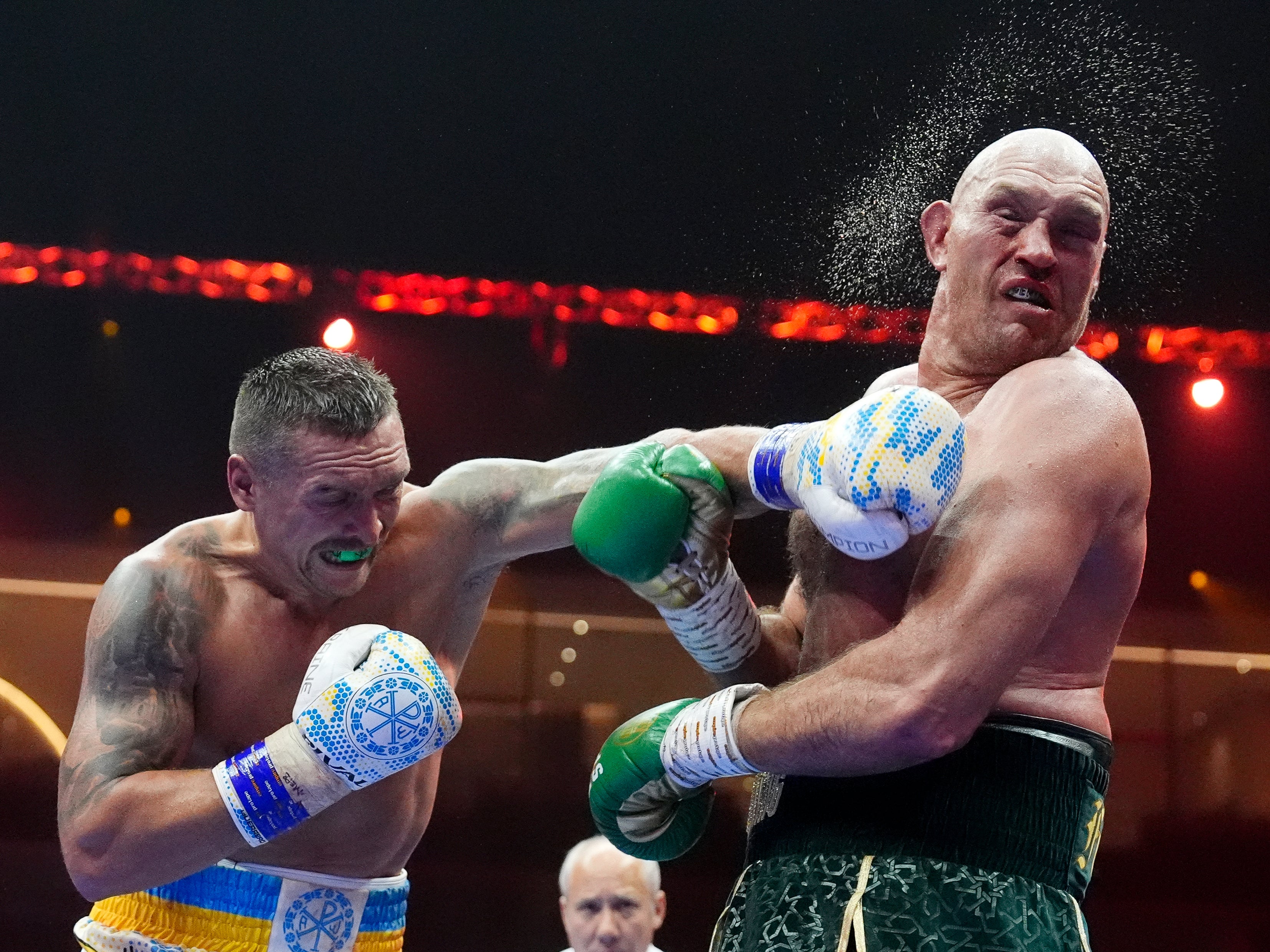 Usyk (left) came close to stopping Fury in round nine