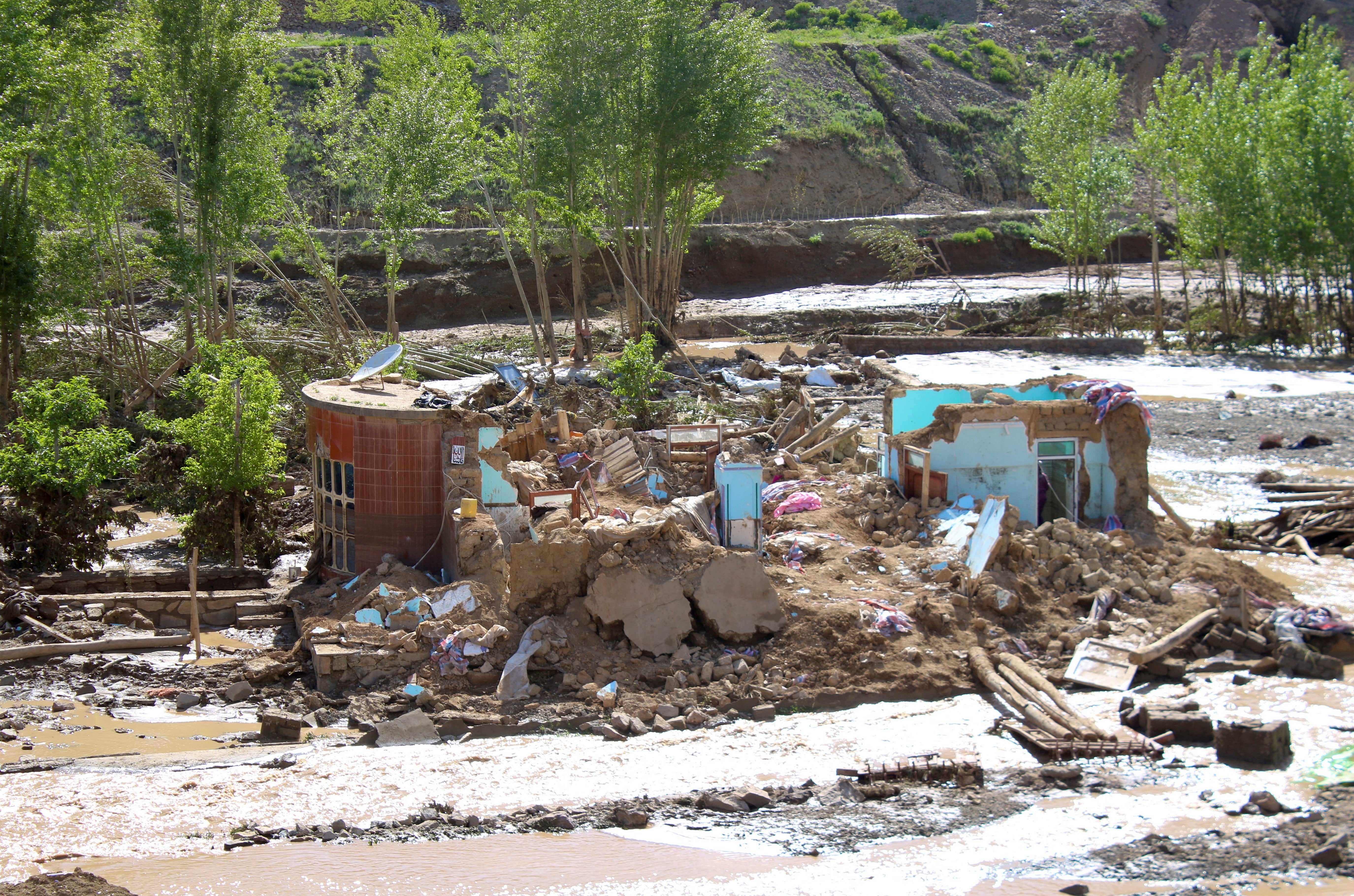 Remainings of houses damaged by the flood are pictured in Firozkoh the capital city of Ghor Province, Afghanistan