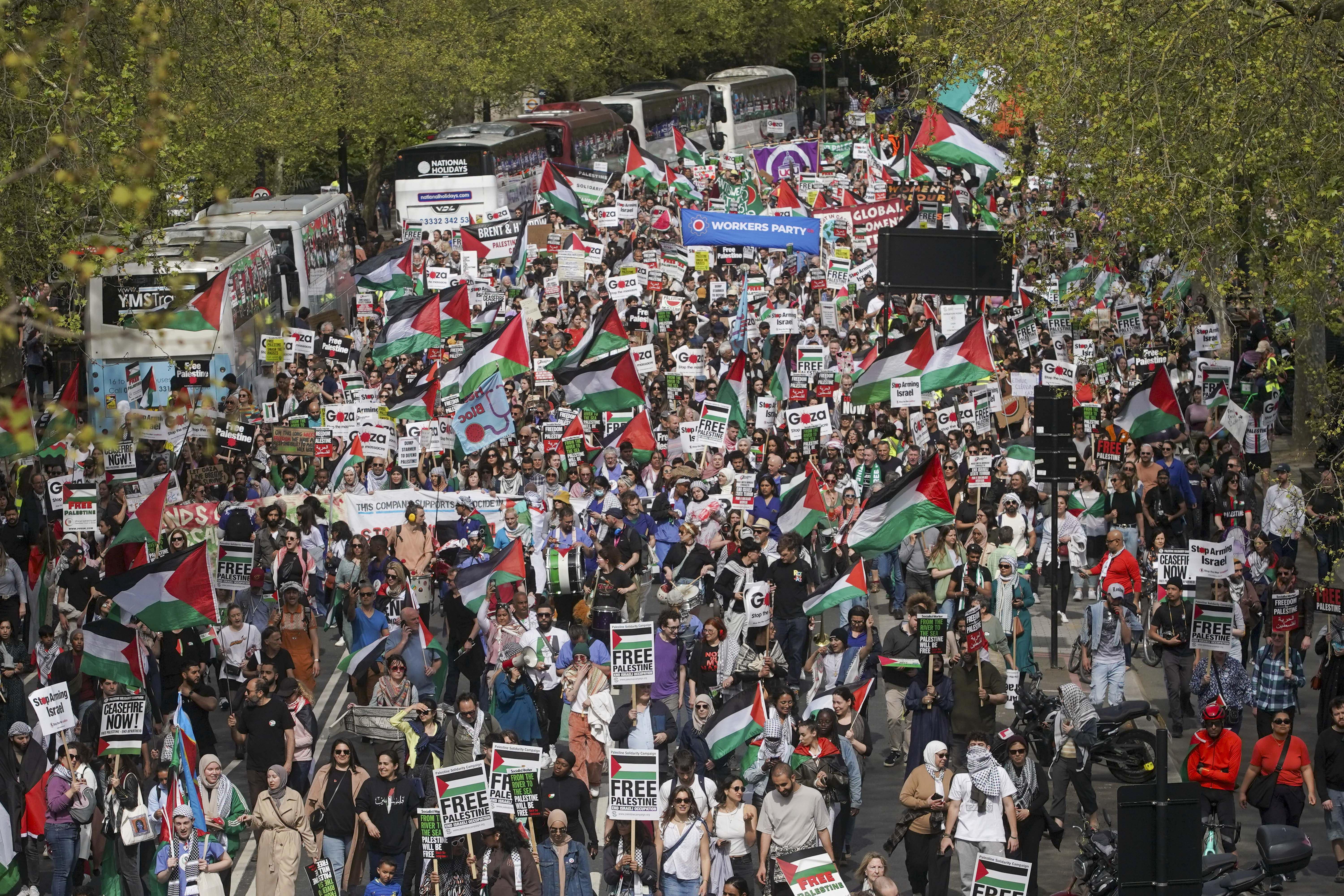 People take part in a pro-Palestine march in central London organised by the Palestine Solidarity Campaign