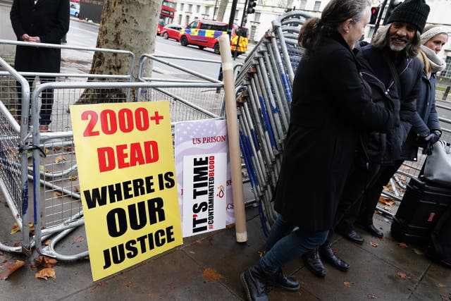 Campaigners outside Downing Street, central London after a letter was handed into Number 10 calling for the Government to speed up compensation for victims of the infected blood scandal (Aaron Chown/PA)