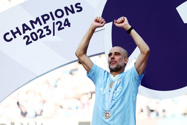 <p>Guardiola celebrates as his team win their fourth Premier League title in a row </p>