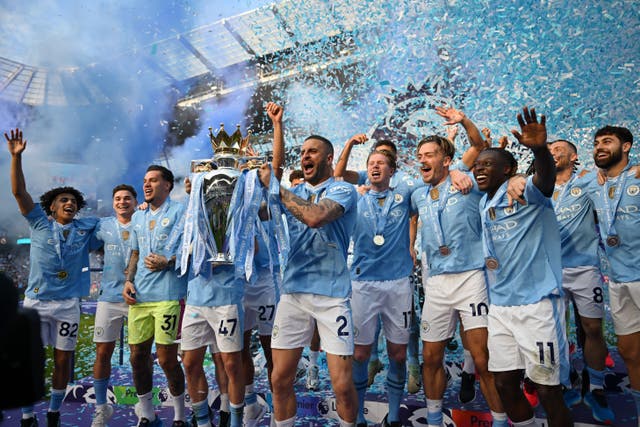 <p>Kyle Walker lifts the Premier League trophy for Manchester City</p>