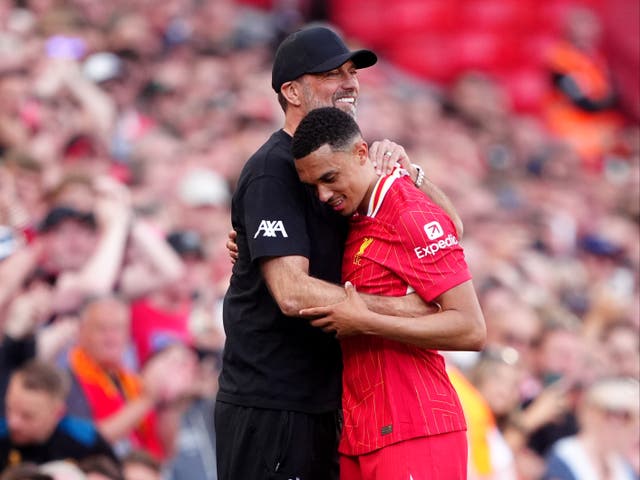 <p>Trent Alexander-Arnold embraces Jurgen Klopp after being substituted</p>