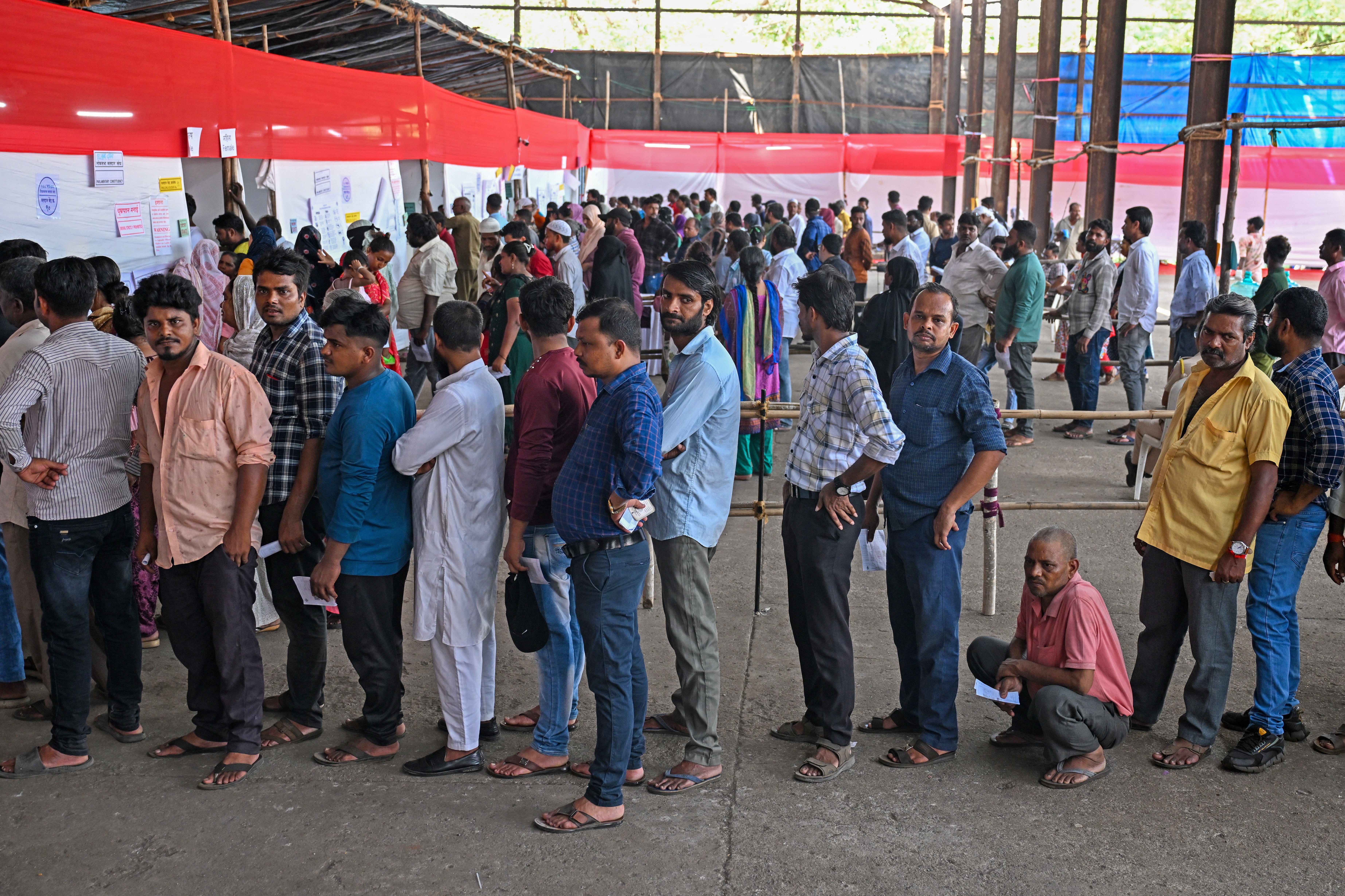 Voters queue to vote in Mumbai during the fifth phase of voting