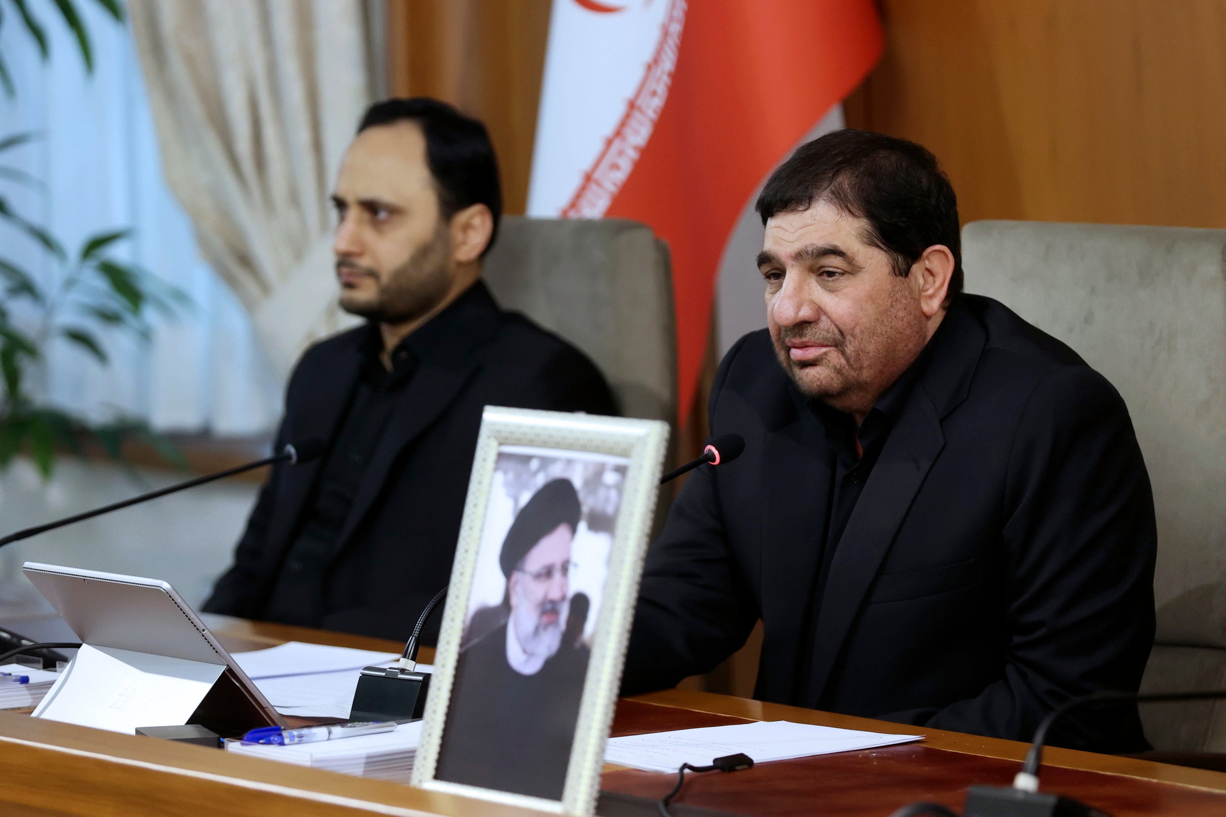 New acting president Mohammad Mokhber, right, led a cabinet meeting in Tehran this morning