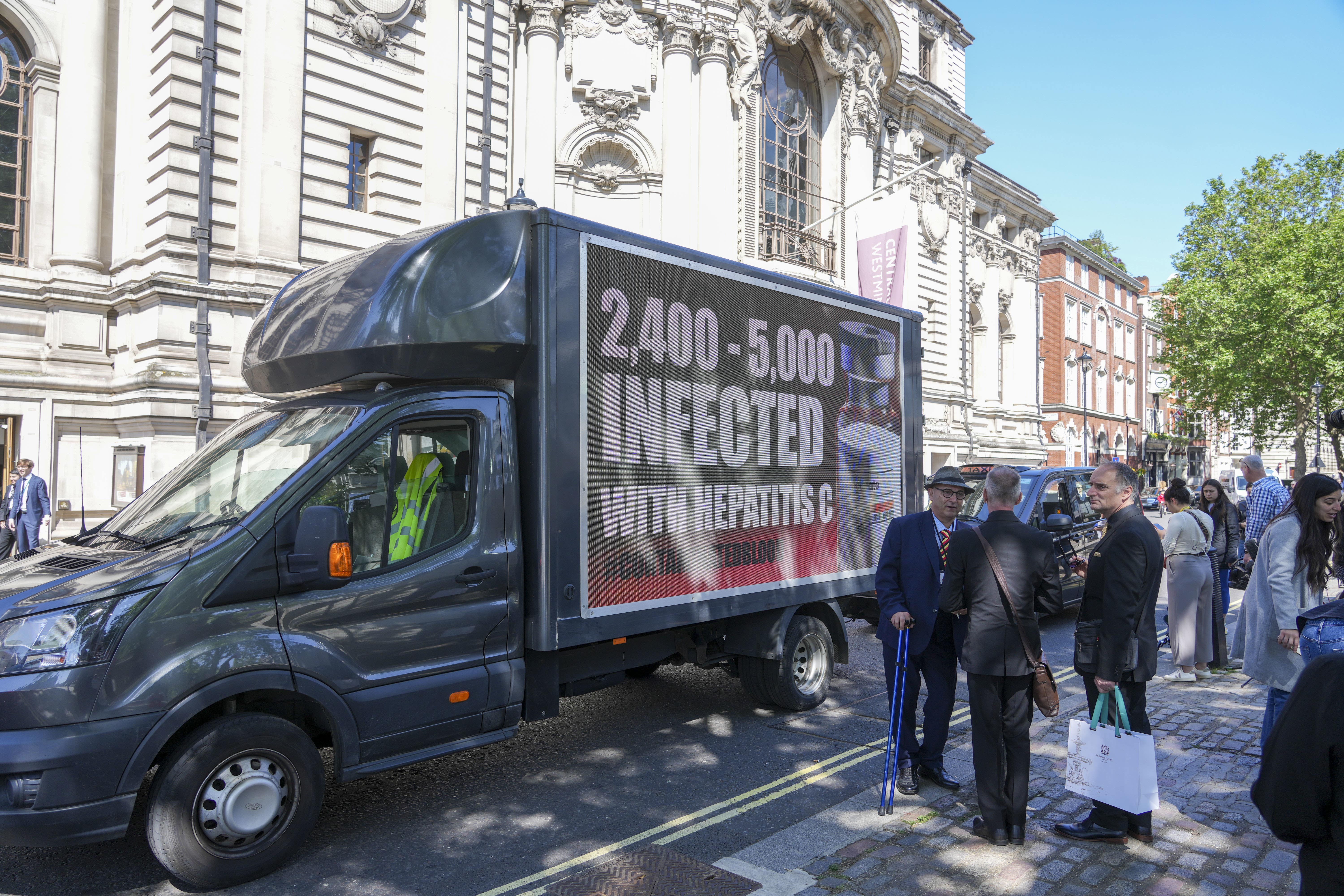 A van carrying a message about infected blood victims outside Central Hall in Westminster (Jeff Moore/PA)