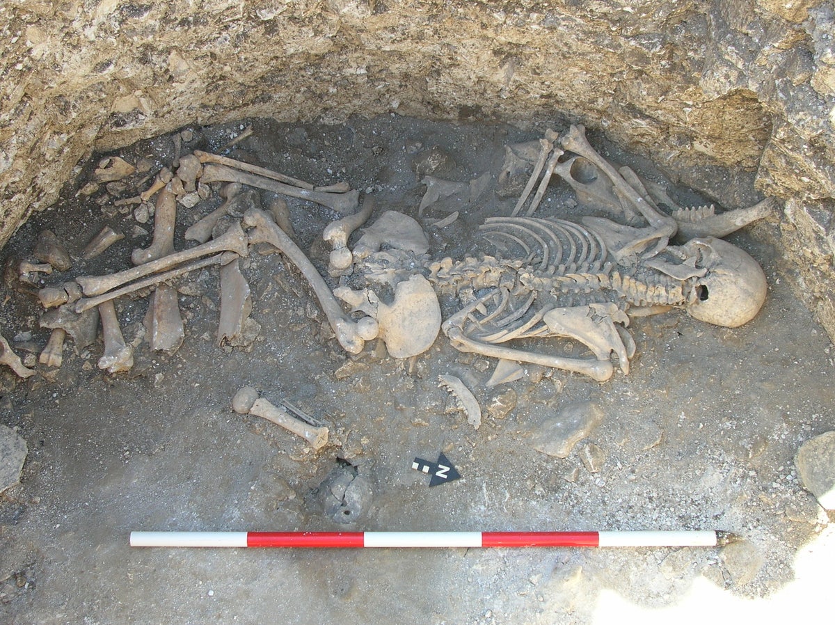 Archaeologists uncover body of girl stabbed in neck as part of human sacrifice