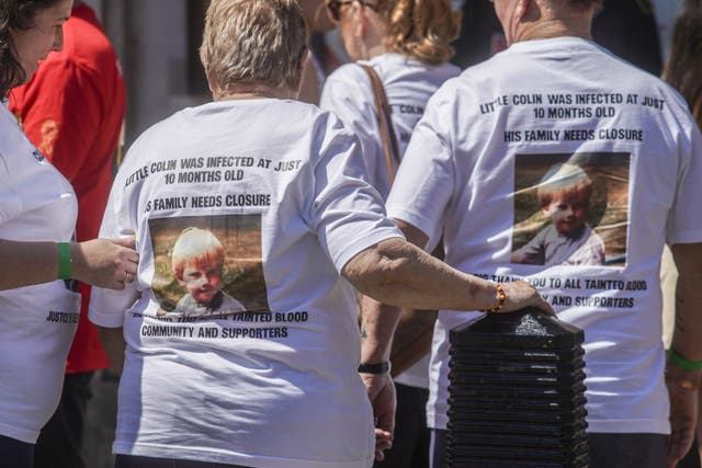 Victims and campaigners outside Central Hall in Westminster, London, after the publication of the Infected Blood Inquiry report (Jeff Moore/PA)