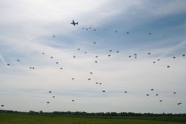 A re-enactment parachute jump of D-Day over Normandy, France, on June 6 2004 (Alamy/PA)