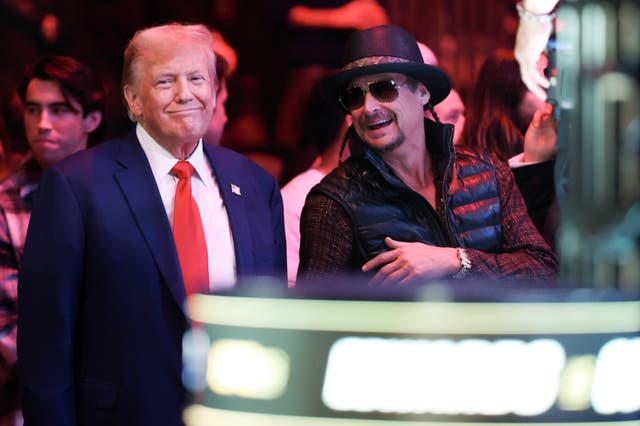 <p>Kid Rock with Donald Trump at a UFC event in December. The MAGA loyalist is accused of using the n-word and waving a gun during a Rolling Stone interview </p>