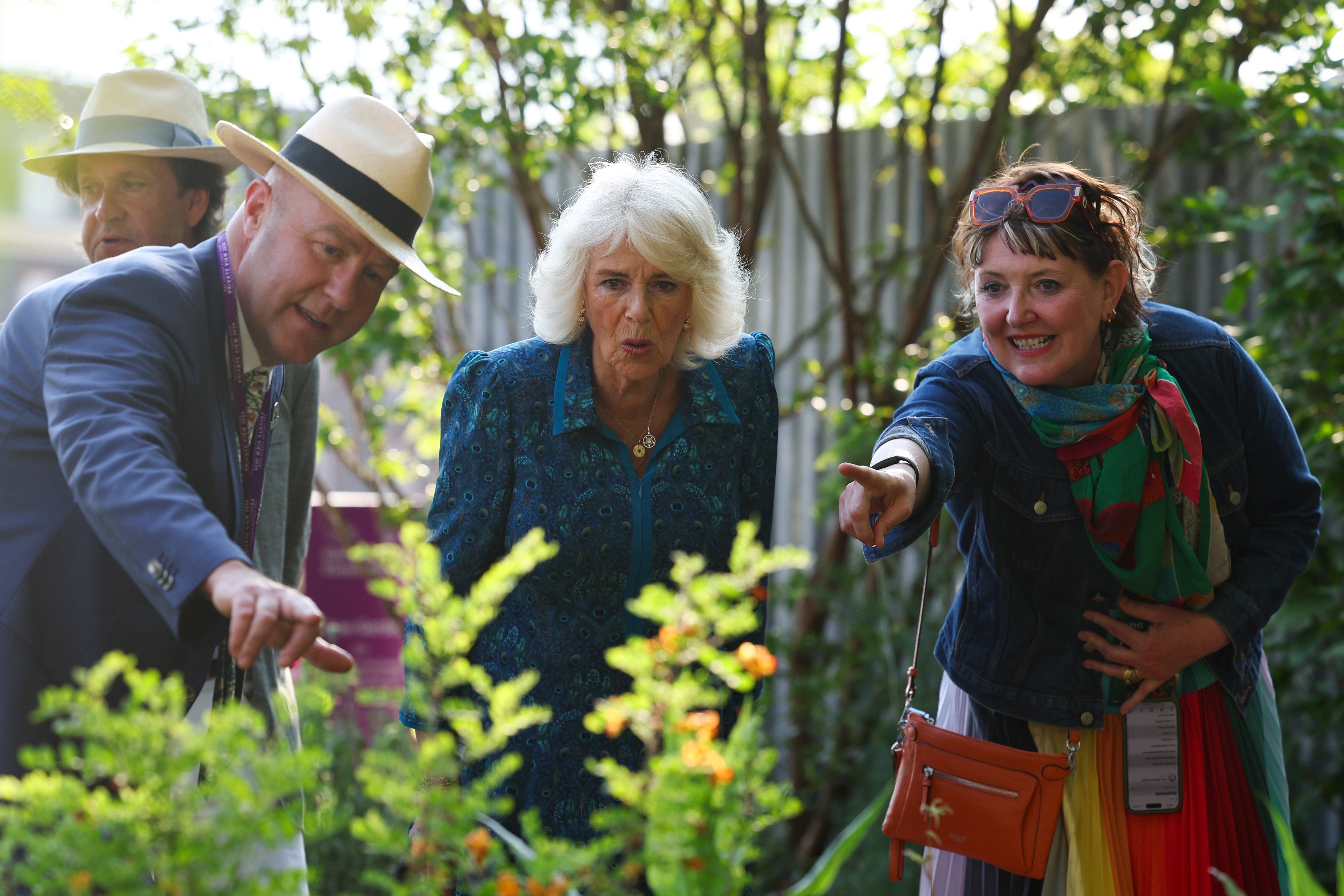 Britain's Queen Camilla (C) reacts as she visits the 2024 RHS Chelsea Flower Show on May 20, 2024 in London, England