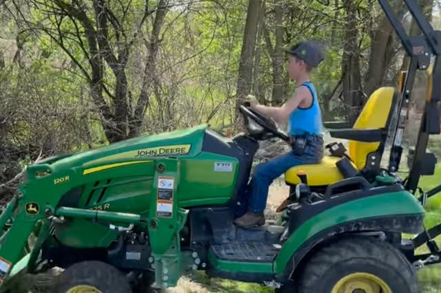 <p>Jackson of the ‘Just A Jackson Thing’ account showing viewers how to clean up debris with a tractor </p>