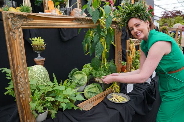 Kate Cotterrill, co-founder of She Grows Veg at her display during the RHS Chelsea Flower Show. (Jonathan Brady/PA)