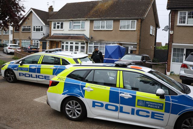 <p>Police guard the scene of the fatal XL Bully attack in Cornwall Close in Havering on Tuesday morning</p>