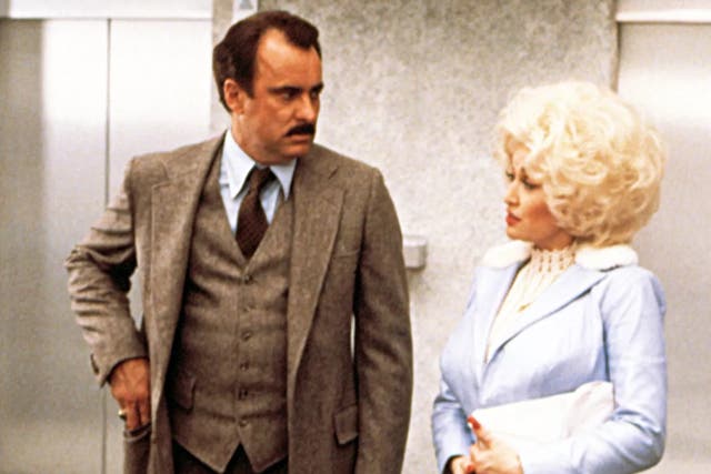 <p>Dabney Coleman and Dolly Parton costar in 9 to 5</p>