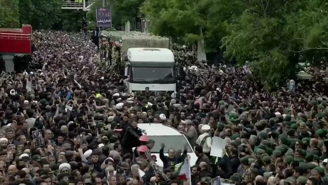 <p>Mourners surround truck carrying remains of Iran president killed in helicopter crash.</p>