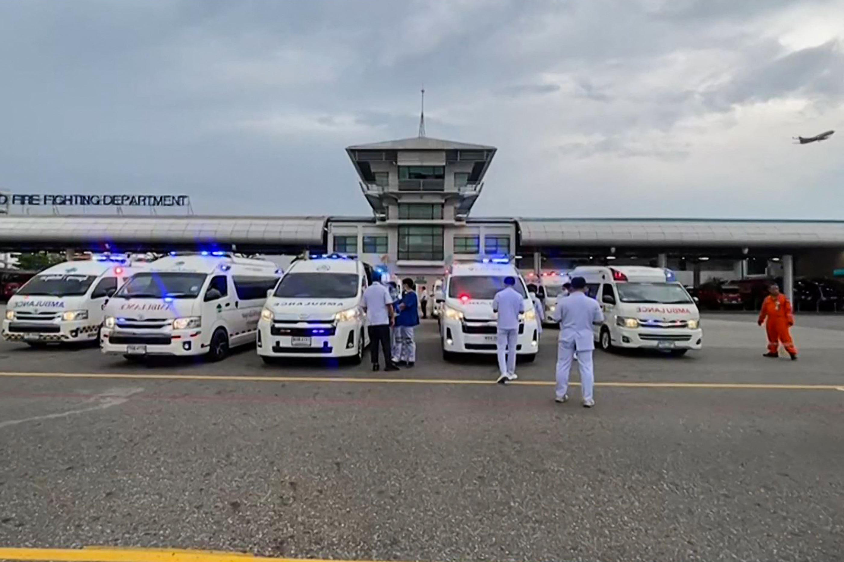 Ambulances at the airport treating passengers onboard the flight