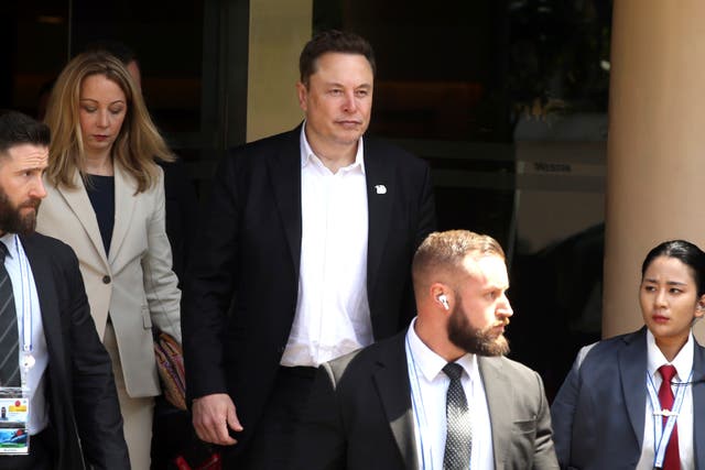 <p>Elon Musk (center) arrives for the 10th World Water Forum in Nusa Dua, Bali</p>