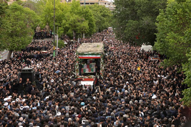 <p>Thousands swarm a truck carrying the Ebrahim Raisi’s body through the city of Tabriz </p>