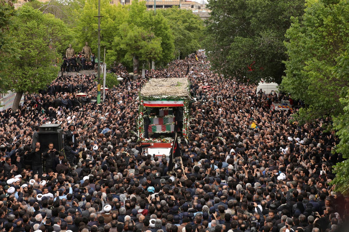 Thousands turn out to mourn Iran’s President Raisi as others celebrate his death