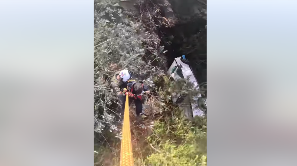 Man who plunged 350ft off California cliff located and rescued by helicopter crew