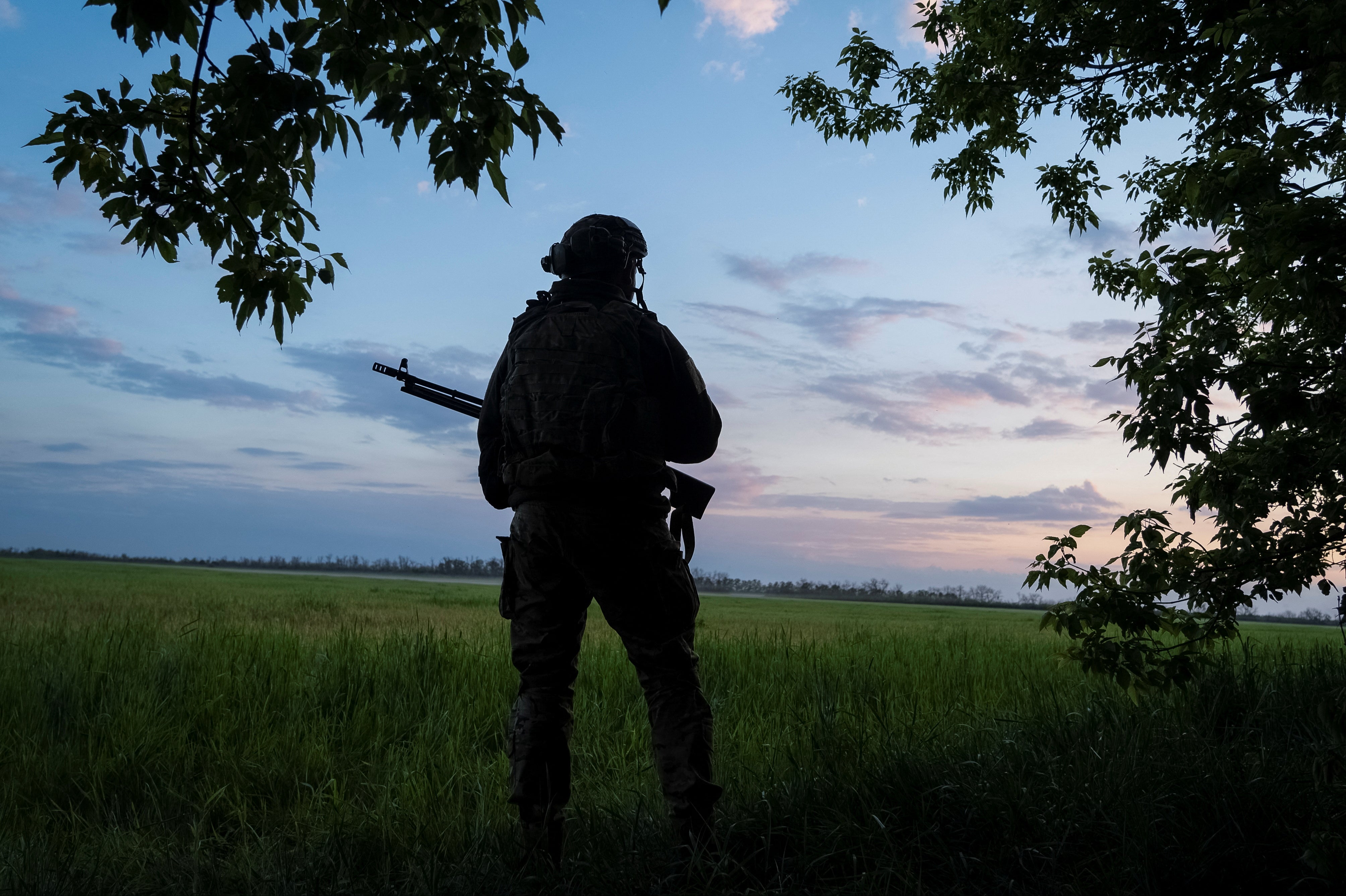 A Ukrainian serviceman of the 92nd separate assault brigade guards an area near the town of Vovchansk in Kharkiv region