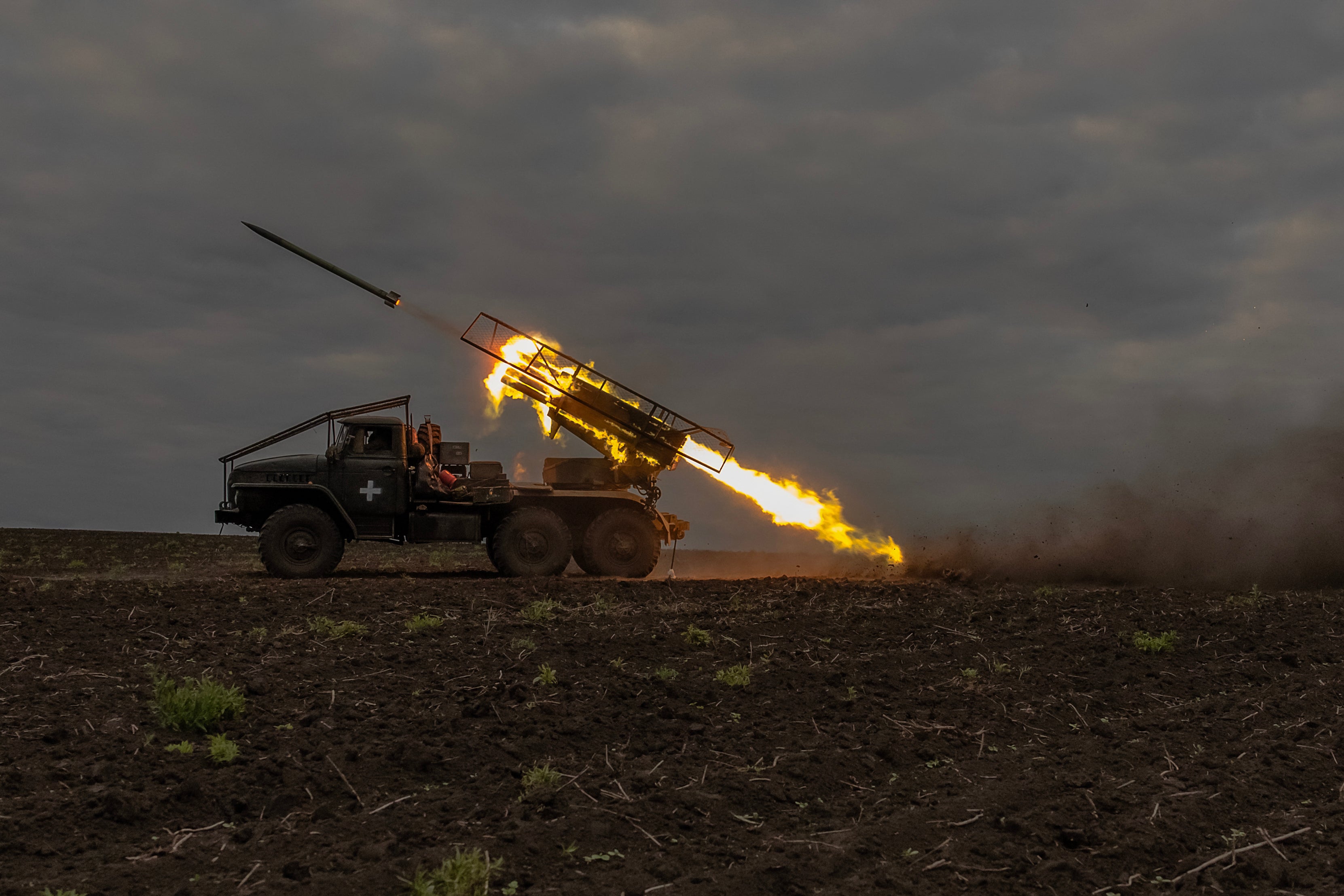 Ukrainian servicemen of the 92nd Assault Brigade fire BM-21 ‘Grad’ multiple rocket launcher towards Russian positions, in the Kharkiv region