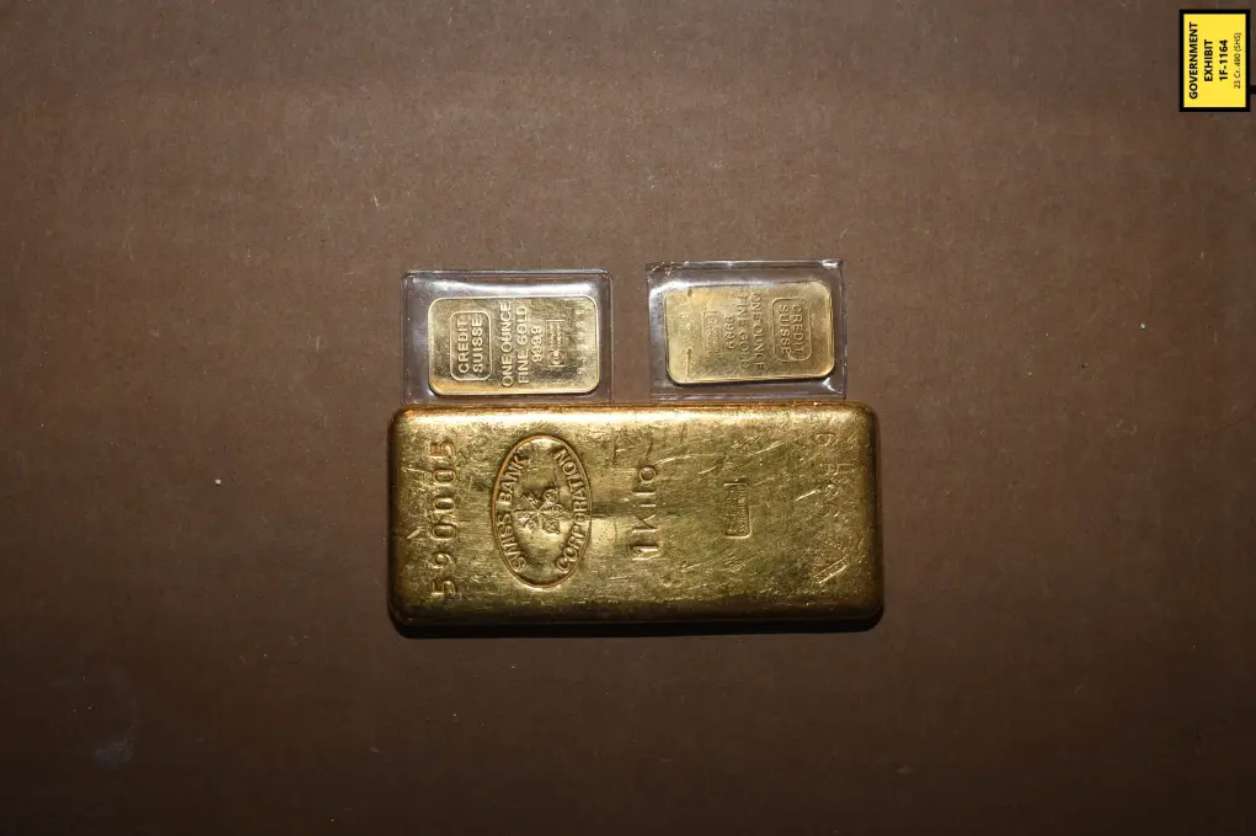 A total of 13 gold bars were found by FBI agents during raids on the home, as well as over $480,000 in cash