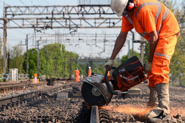 <p>Line closure: Network Rail engineers working on the West Coast main line near Watford</p>