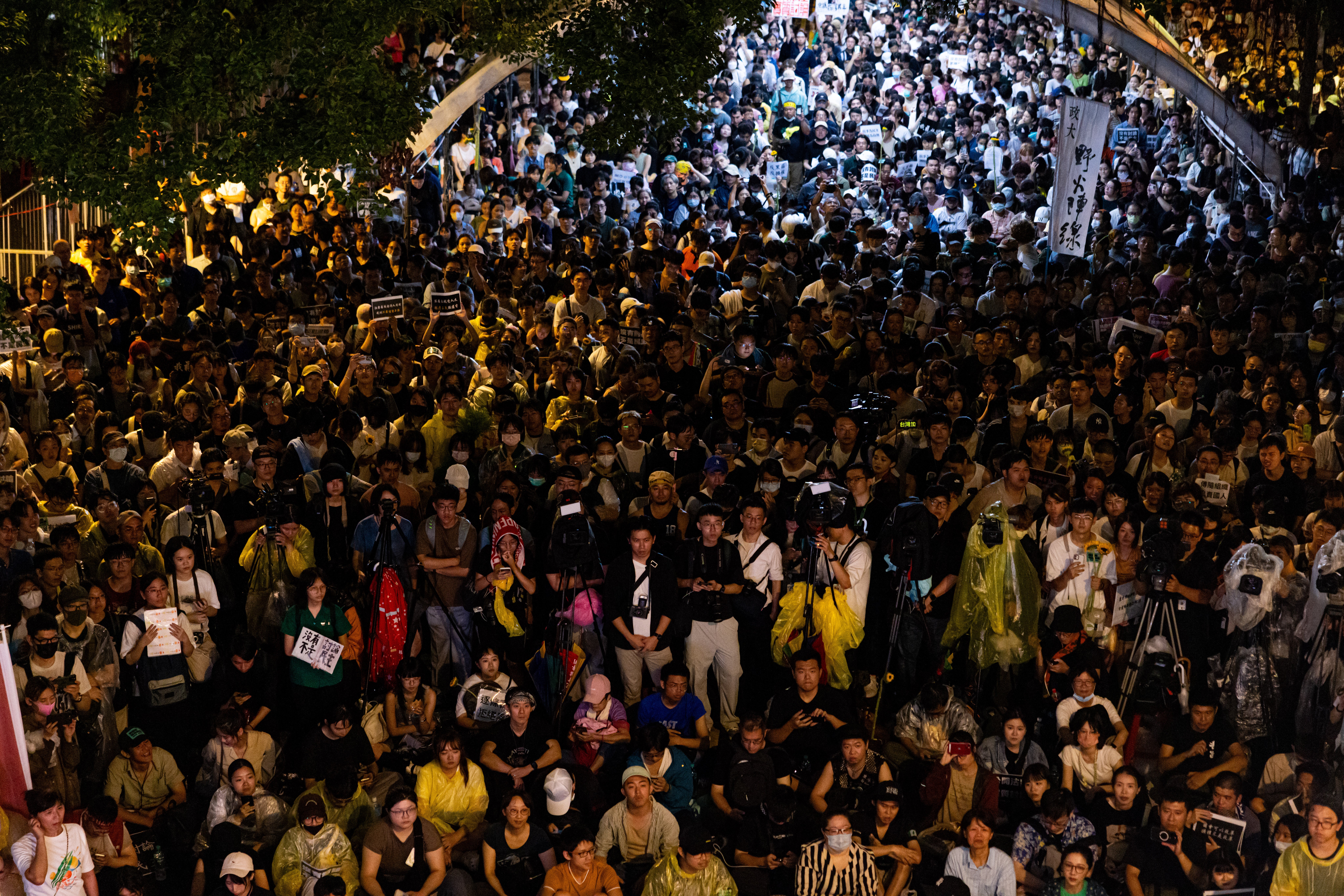 Protesters gather outside Taiwan’s parliament in Taipei