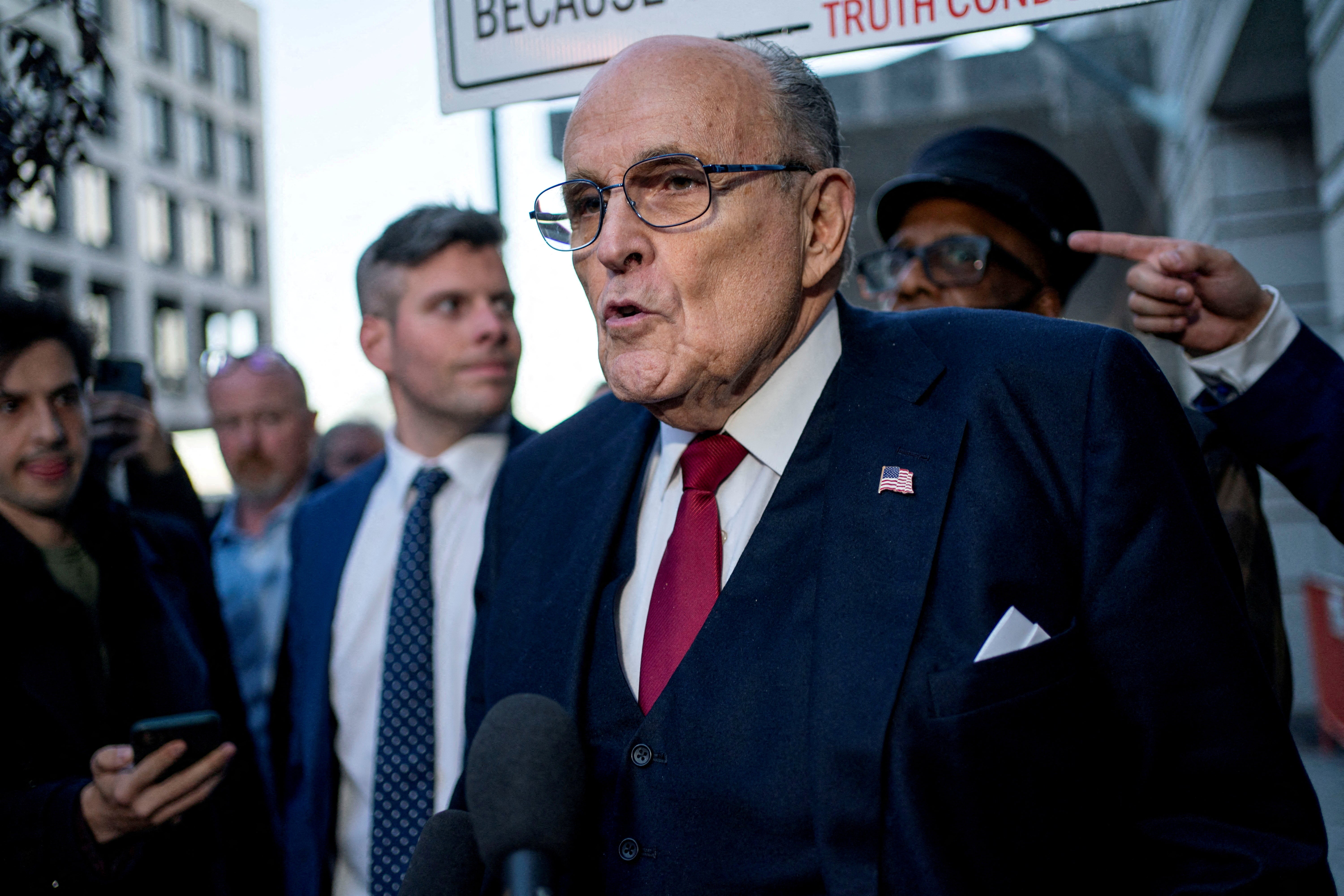 Former New York Mayor Rudy Giuliani departs the U.S. District Courthouse in Washington on December 15, 2023. He was ordered to pay $148m in damages to two election workers.