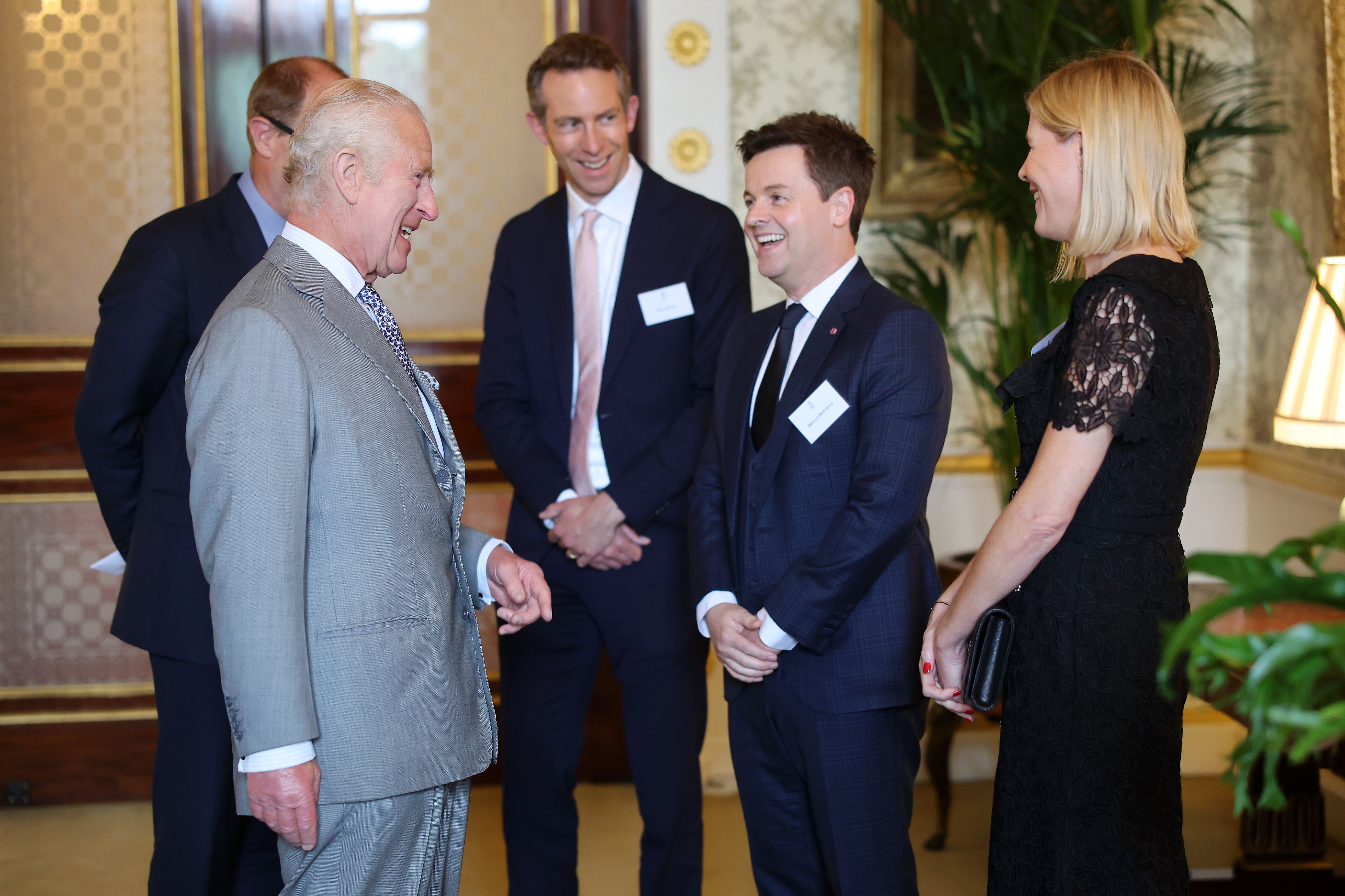The King meets Declan Donnelly and Ali Astall during a reception for winners, supporters and ambassadors of the Prince's Trust Award 2024 at Buckingham Palace in London (Chris Jackson/PA)