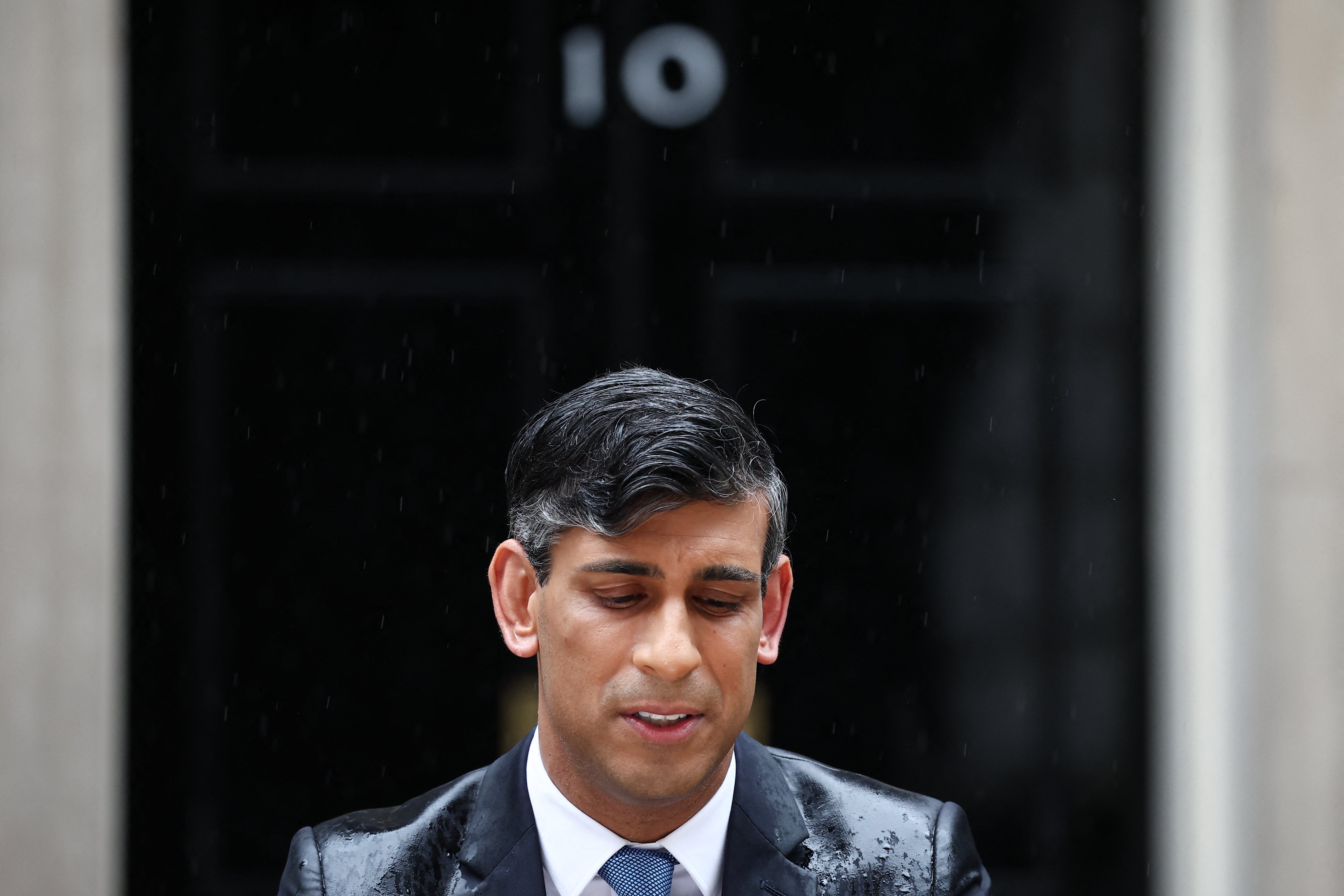 Heavy rain poured down on Rishi Sunak as he announced a July 4 General Election outside No 10