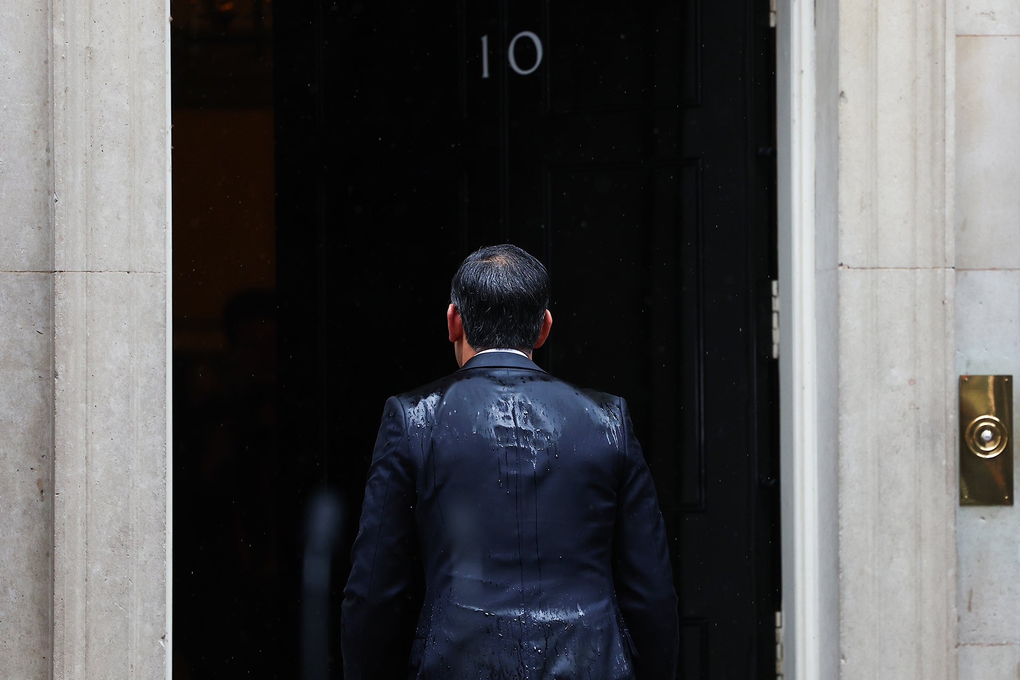 UK Prime Minister Rishi Sunak, returns inside No.10 after announcing the date for the UK General Election at Downing Street on May 22, 2024 in London