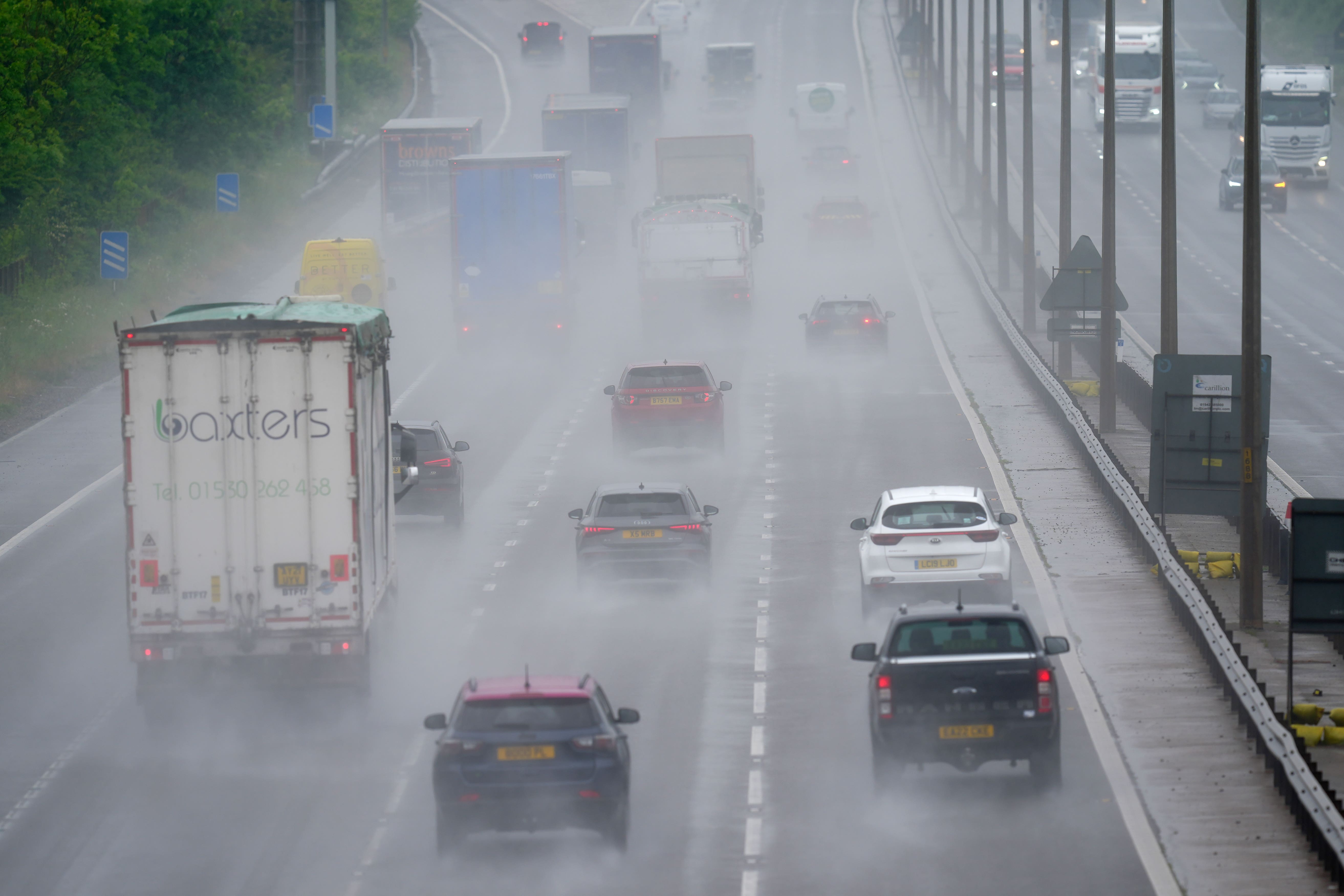 A general view of motorists in rain on the M5 northbound (David Davies/PA)