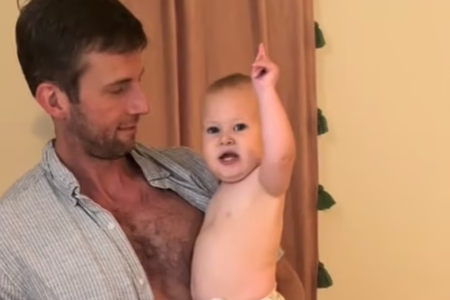 <p>Will Wise holds his infant daughter Kate as she hilariously react to her mother Bailey’s question (@sobrizzle/TikTok)</p>