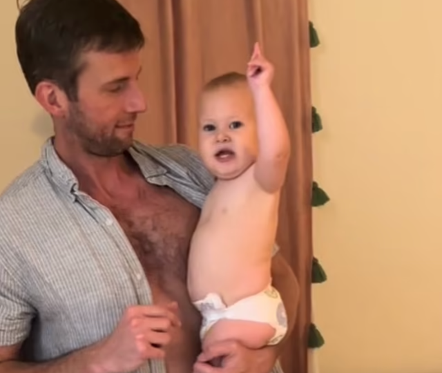 <p>Will Wise holds his infant daughter Kate as she hilariously react to her mother Bailey’s question (@sobrizzle/TikTok)</p>