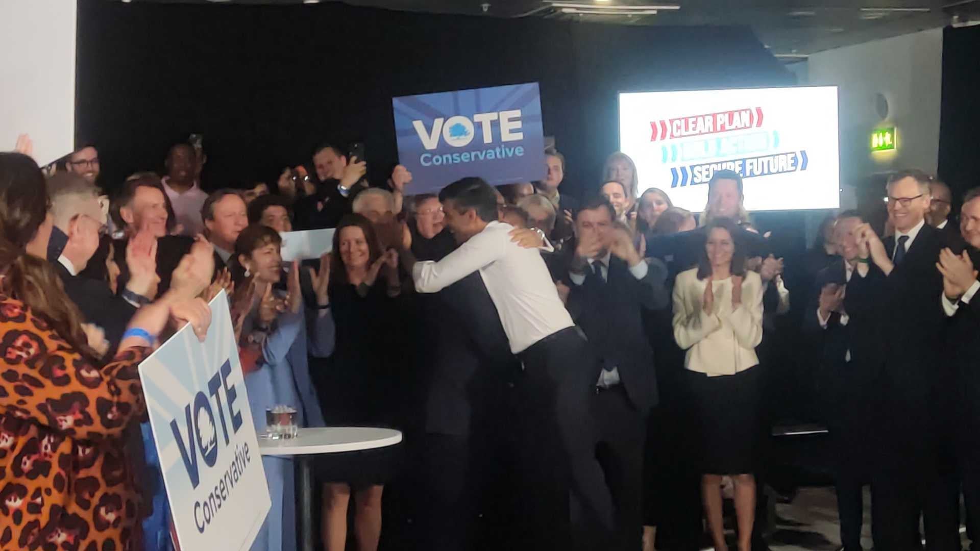 Mr Cleverly and Mr Sunak hug at the campaign launch