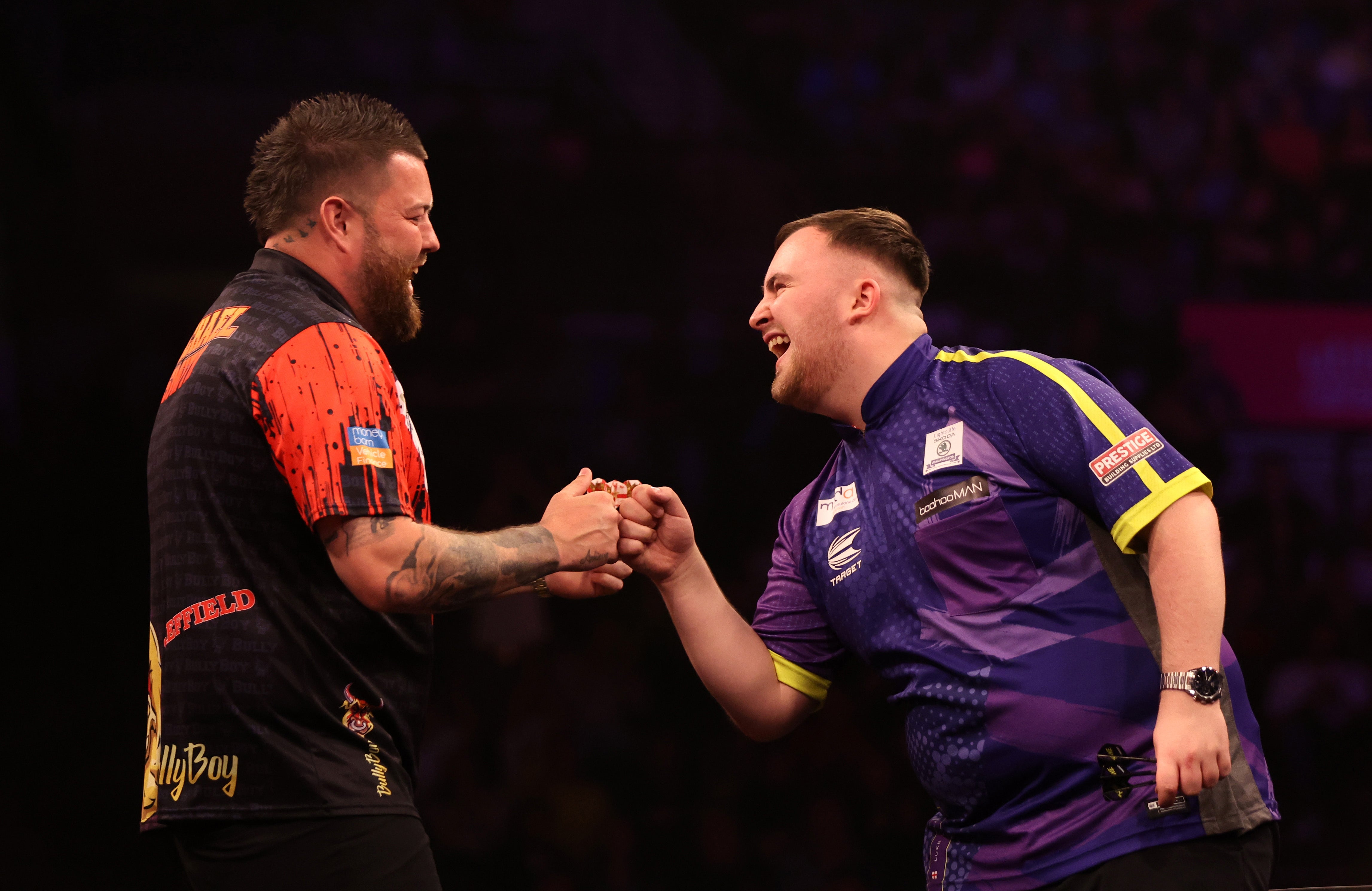 Like Littler and Michael Smith share a joke on night 16 in Sheffield