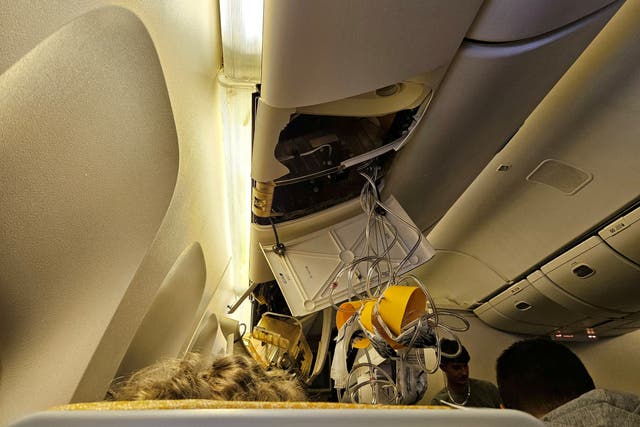 <p>Danger zone: Interior of Singapore Airlines flight SQ321 after its emergency landing at Bangkok</p>