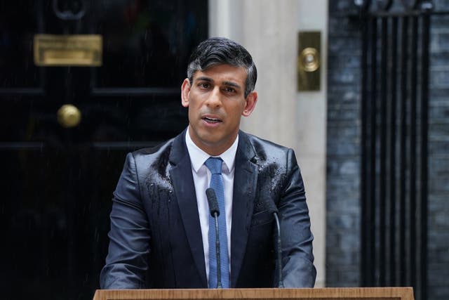 Prime Minister Rishi Sunak was soaked while making a speech outside No 10 (Lucy North/PA)