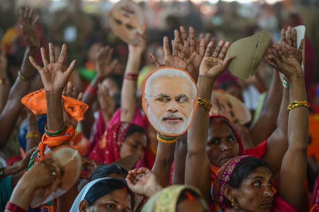 <p>Narendra Modi’s supporters gather to hear the prime minister speak during a rally in Allahabad</p>