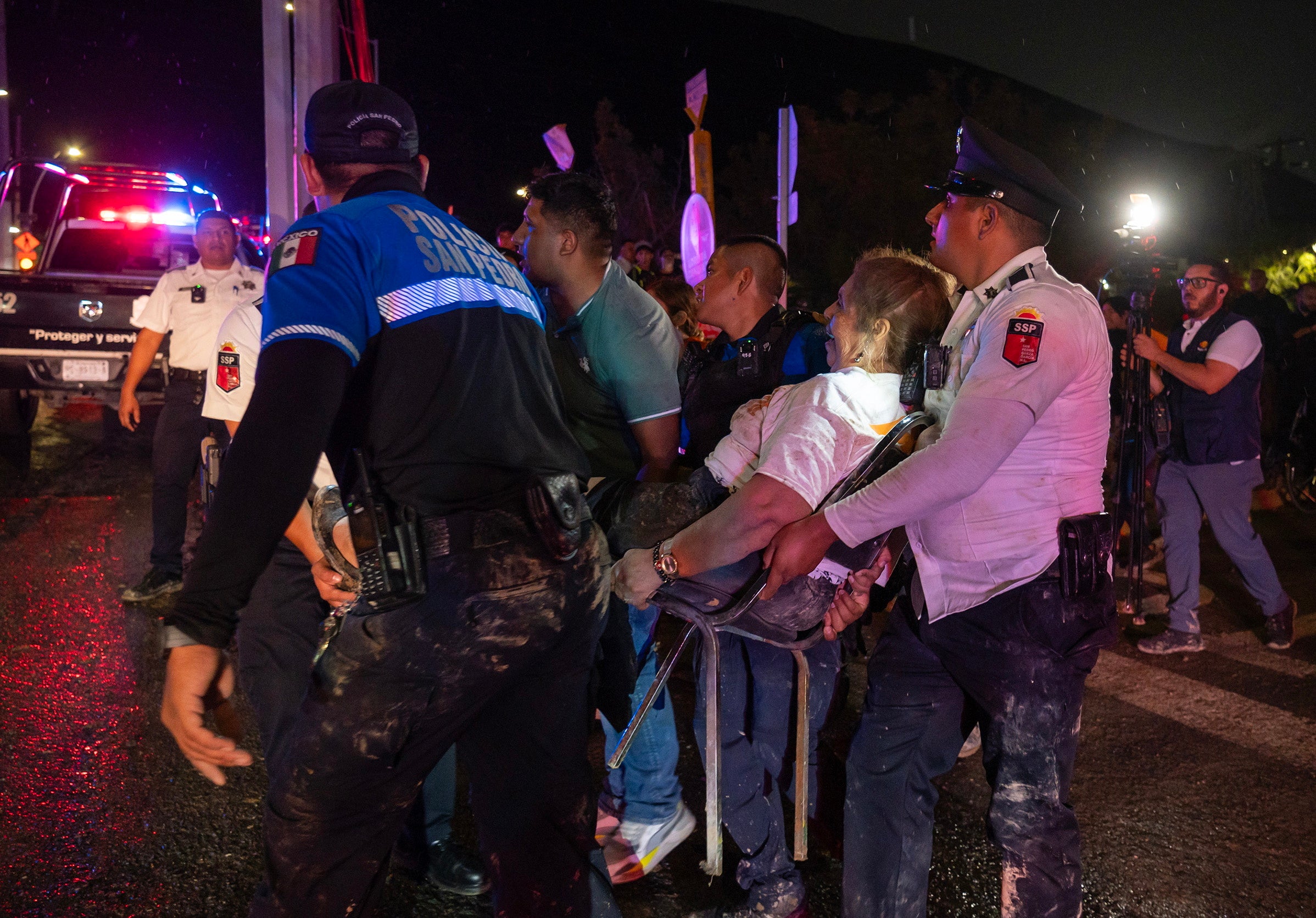 Paramedics evacuate one of the injured people after a stage collapsed at an election campaign rally in a suburb of Monterrey, capital of the northern Nuevo Leon state, Mexico