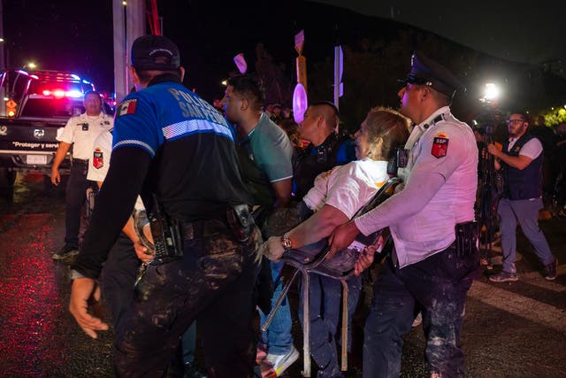 <p>Paramedics evacuate one of the injured people after a stage collapsed at an election campaign rally in a suburb of Monterrey, capital of the northern Nuevo Leon state, Mexico</p>