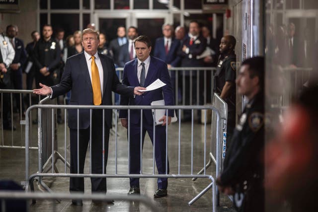 Former President Donald Trump, left, speaks to reporters alongside his attorney Todd Blanche following the day’s proceedings in his trial in Manhattan Criminal Court on May 21