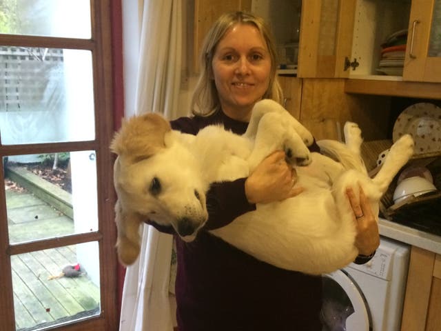 <p>Charlotte with her golden retriever, Muggles</p>